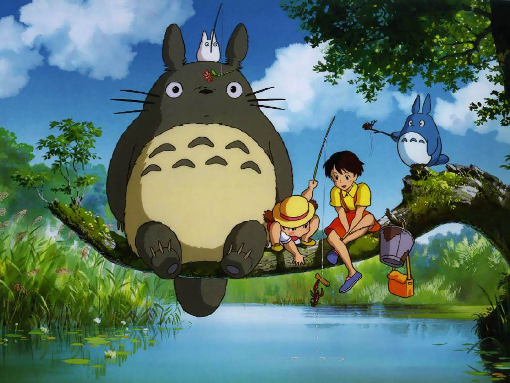 Totoro is the big gray rabbit-like creature on the left.