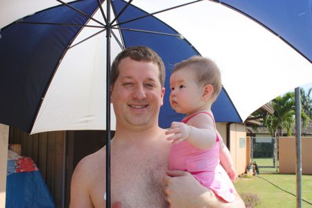 I was under the impression that umbrellas were for the rain, but daddy says it will protect me from the sun. And by "me", I think he really means "us"...
