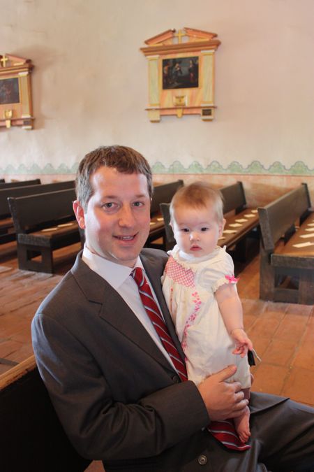Daddy and I taking our seats in church - people say the seats are uncomfortable, but I didn't think - course I was sitting on my daddy...