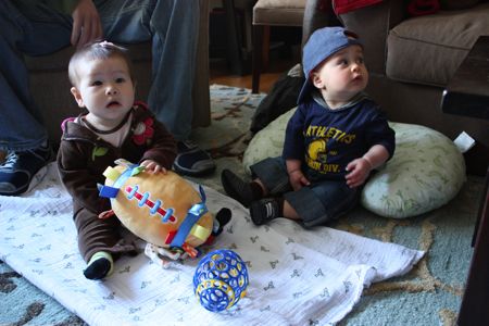 Wills brought over some footballs so we could get in the mood for the big game - I quickly grabbed all of them. I've been doing that lately btw - I pile up all the toys in front of me. Mommy and daddy say they are going to "work with me" on this tendency. I'm not sure if that means that will teach me new ways to steal the toys or make me share more - I hope its the former!