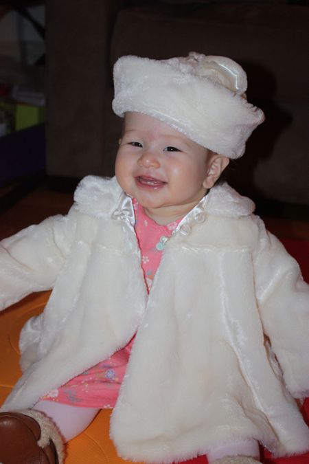 Daddy thinks this jacket and hat make it look like Maile is celebrating Easter in Moscow...