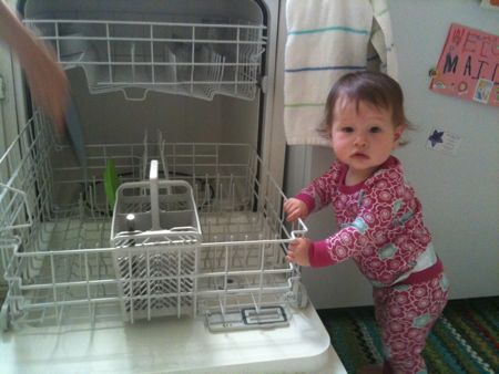 Doing the dishes with mommy...