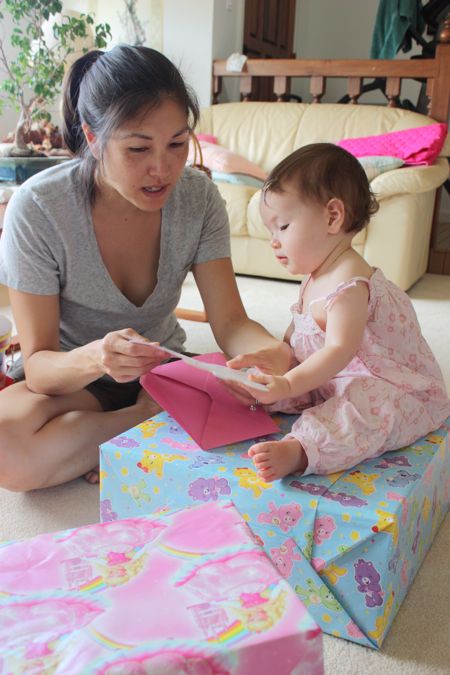 Mommy teaching Maile that you always read the card first...
