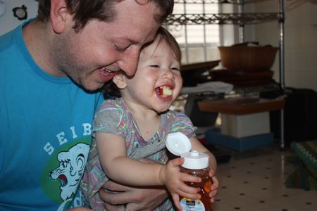 Yummy, yummy, yummy! Maile liked the honey ... a lot! ... but she had trouble keeping everything in her mouth. Mommy and daddy are still finding honey on their arms and clothes...