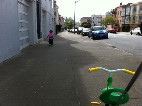 Maile hasn't quite grasped that going for a bike ride actually involves riding on a bike...