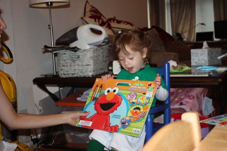 Can't wait to dig into this Elmo book. (Check out my new blue rocking chair too...)