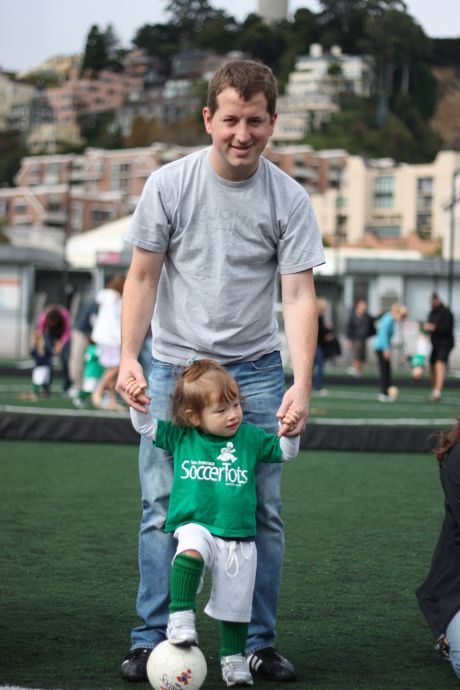 After stretching, we practice our soccer skills - Daddy helps with balance, but Maile is getting pretty good at standing with one foot on the ball...