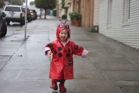 Maile loves playing outside in the rain...