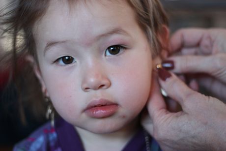 Grandma Jill helped me put on the earrings...