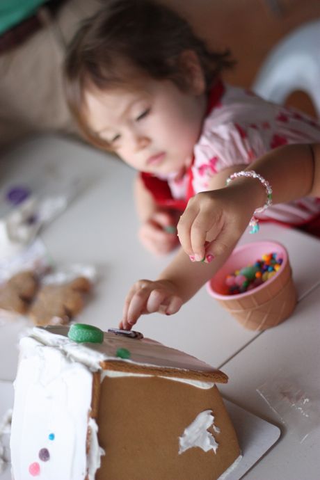 Decorating the gingerbread house is serious business!