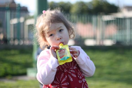 Mailes loves her some apple sauce!