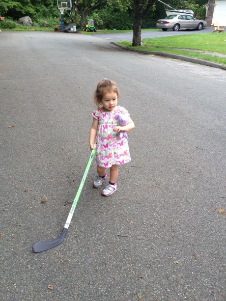 Pretty good form for her first time holding a hockey stick - she didn't get this from Daddy!