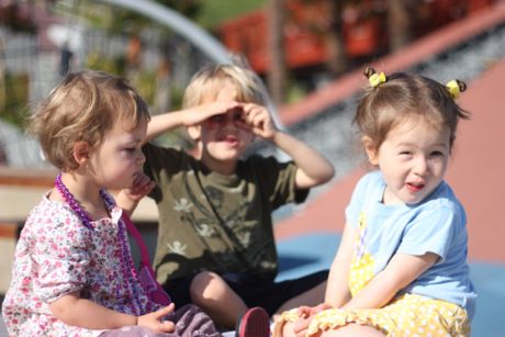 Madeleine, Harold and Maile eating some snacks to build up some energy for the playground...