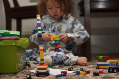 Maile GIrl surrounded by her Lego creations...