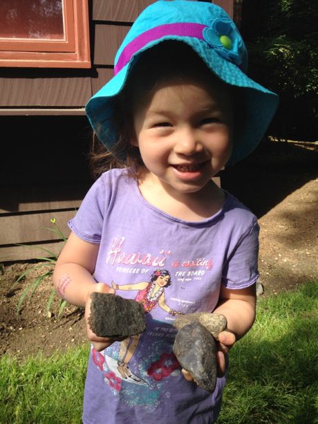 First, I had to look all around the backyard for rocks to put in the bottom of the pots.