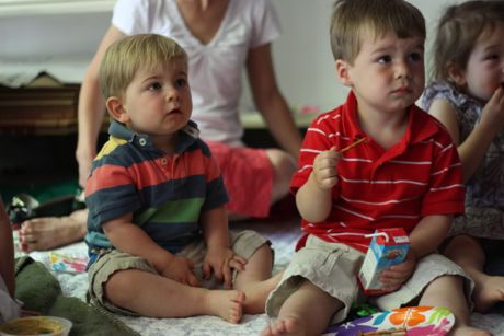 Sam and Jake taking in the puppet show - incredibly the kids stayed put for the whole show...