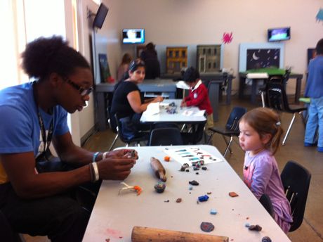 Learning the ropes from one of the museum staff.