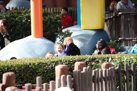 Maile and Daddy in line for Maile's very first roller coaster ride...