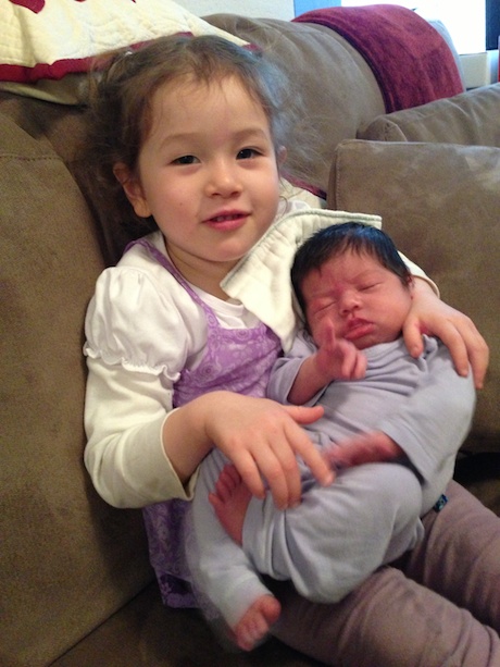 Maile is getting good at holding her little sister...