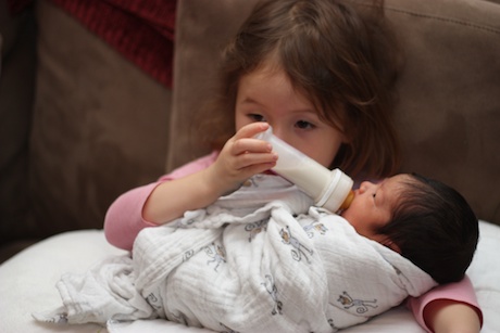 Mommy taught me to lift the bottle up so no air gets in - the air makes Lauren uncomfortable.