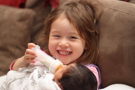 And then you just give a big smile because you are feeding your baby sister!