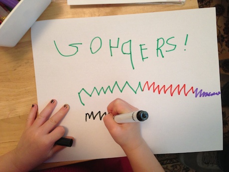 Before the game, Maile set to work creating a Go 49ers sign!
