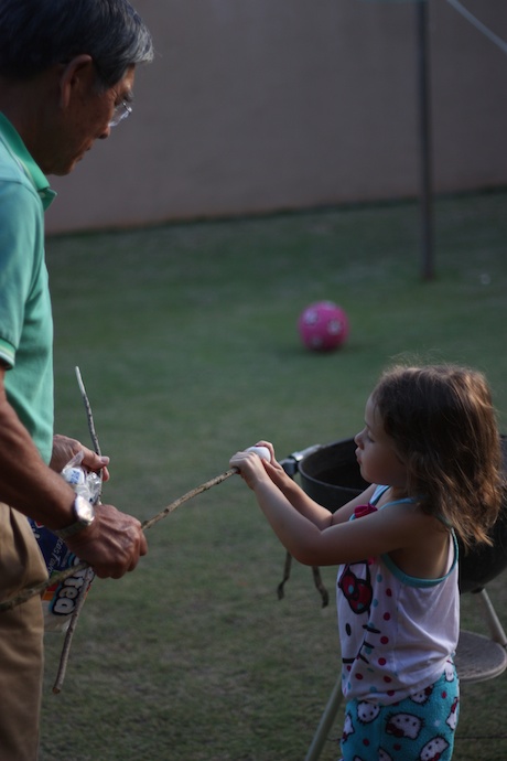 First you have your Papa make a fire and then you find a nice long stick and you place the marshmallow on the end of it...