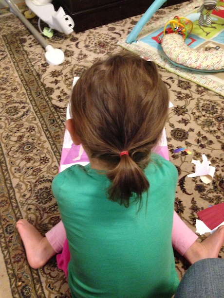 On Day #3, he tried a few pig tails, but then resorted to the ol' pony tail. I think it stayed in for about 5 minutes when I got to school.