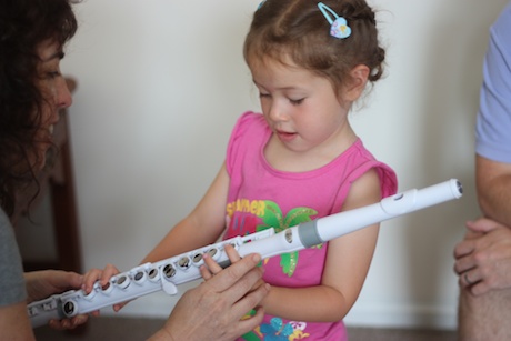 Then they put the full flute together and Maile learned about the keys and how pressing them made different sounds...