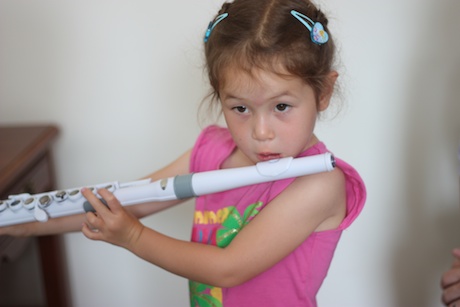 ... and becoming the cutest flutist ever!