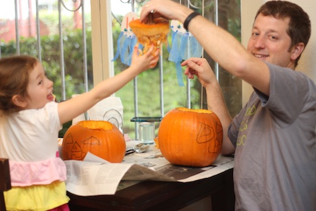 Alright, let's get this going - Daddy kicked off the scooping of the gunk part of the pumpkin carving.