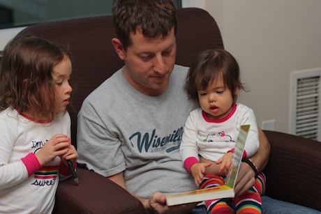 Daddy reading stories to Lauren and Maile...
