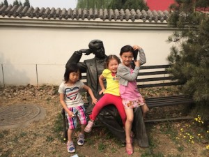 Posing with Teddy Roosevelt statue with Michelle and Olivia