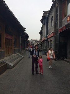 Mommy and Maile at the start of our Hutong tour - this was one of the wider sections...