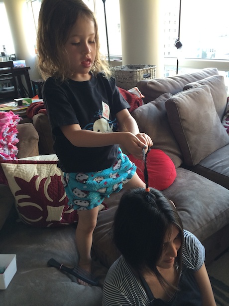 Maile Girl very focused on her braiding technique...