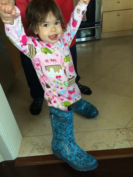 Lauren Girl trying on Mommy's rain boots...