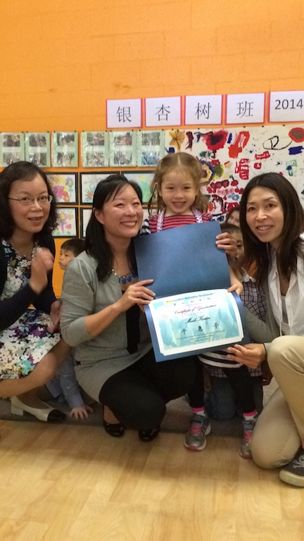 Maile receiving her diploma from her lao shis: Shu-ying, Ruth and Fei