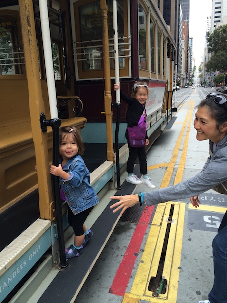 The girls hanging off the side (with a little assist from Mommy)