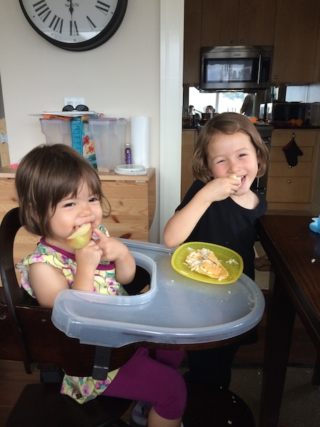 Maile and Lauren enjoying apples and honey on Rosh Hashanah
