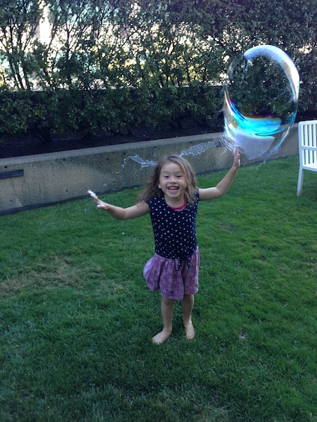 All smiles playing with the bubbles :)