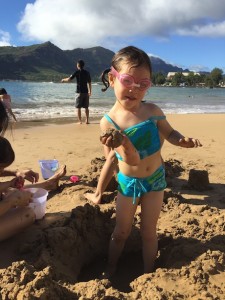 Maile loves playing in the sand at the beach...