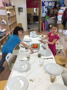 Maile and her friend, Zoe, getting the table all setup.