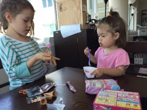 Maile Girl digging in to her poppin' cookin' set...