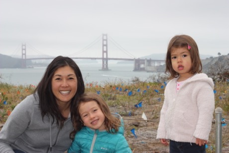 A mother and her daughters with the Golden Gate in the background