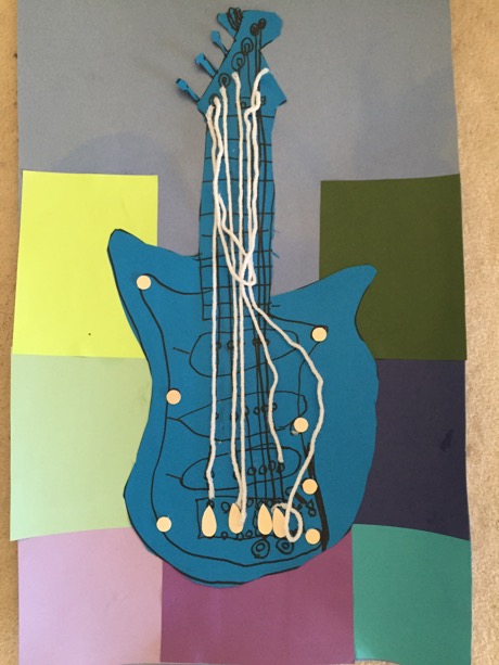 A guitar art piece that Maile made at Camp Galileo