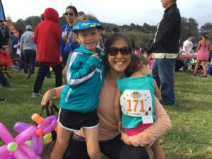 Mommy and the girls ready to rock (Lauren was being shy, but gave us a nice view of her racing number)...