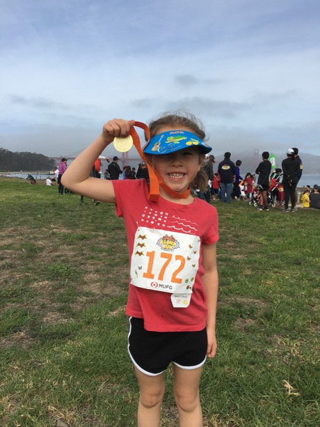A post-race Maile showing off her medal...