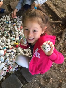 Maile showing off her painted rock!