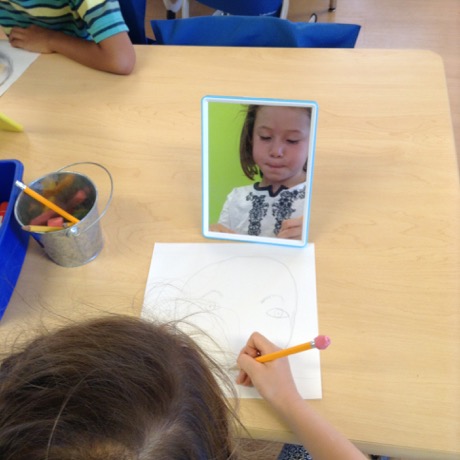 Great shot of Maile Girl working hard on her self portrait