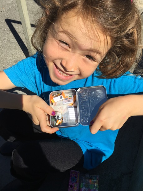 Maile with her very first cache!